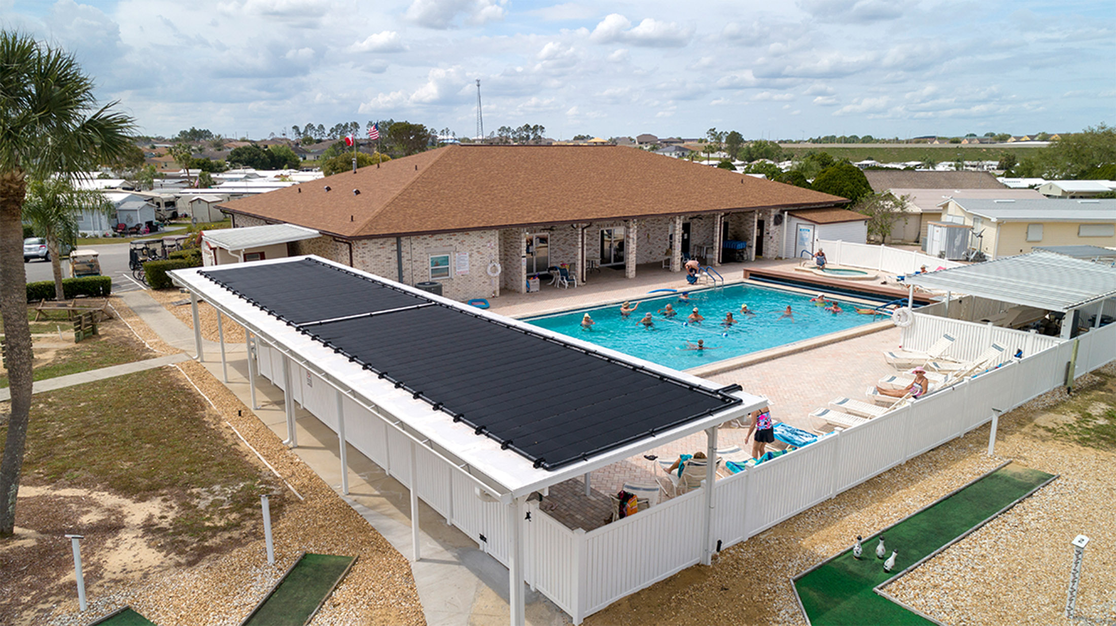 Solar thermal pool heating array array at a community pool makes swimming year-round possible.